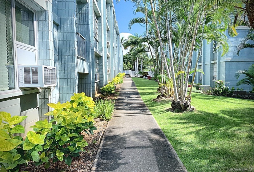 The walkway from the covered parking stall (76-B) heading towards the unit