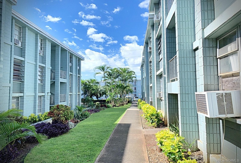 The same walkway heading from the unit to the parking area