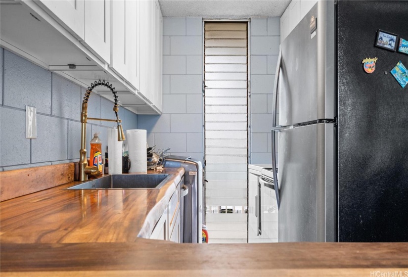 Kitchen with beautiful  wooden countertops and natural lighting