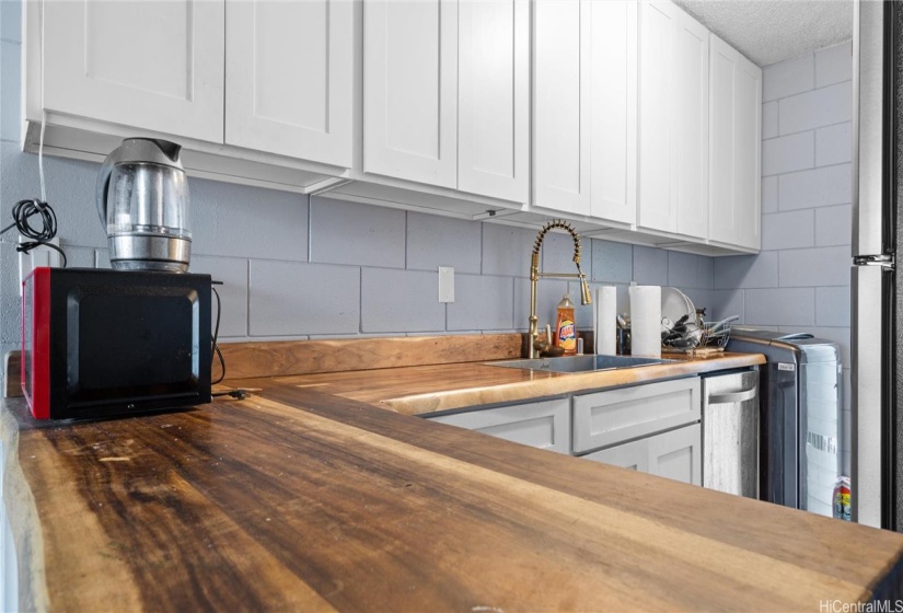 Kitchen with large custom wooden countertops