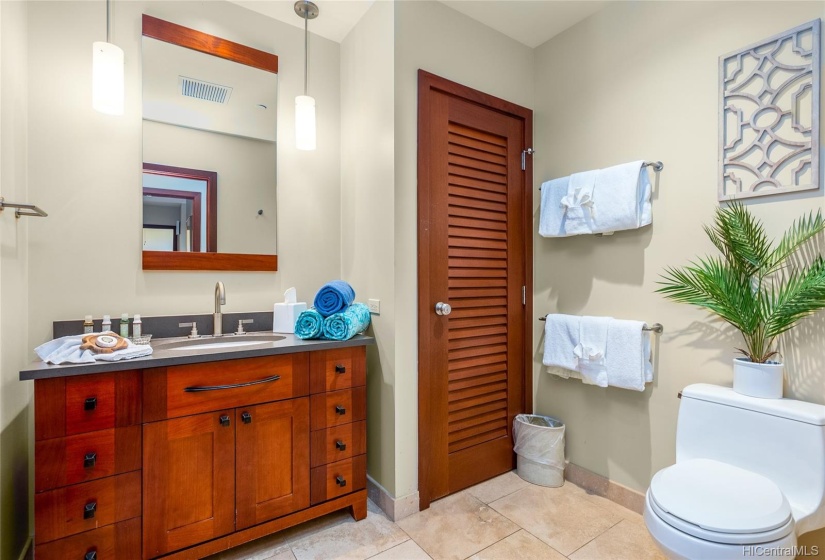 En Suite bath from 2nd master suite with deep soaking tub/shower combo, locked linen closet or owner storage (one of three in-unit storage areas)