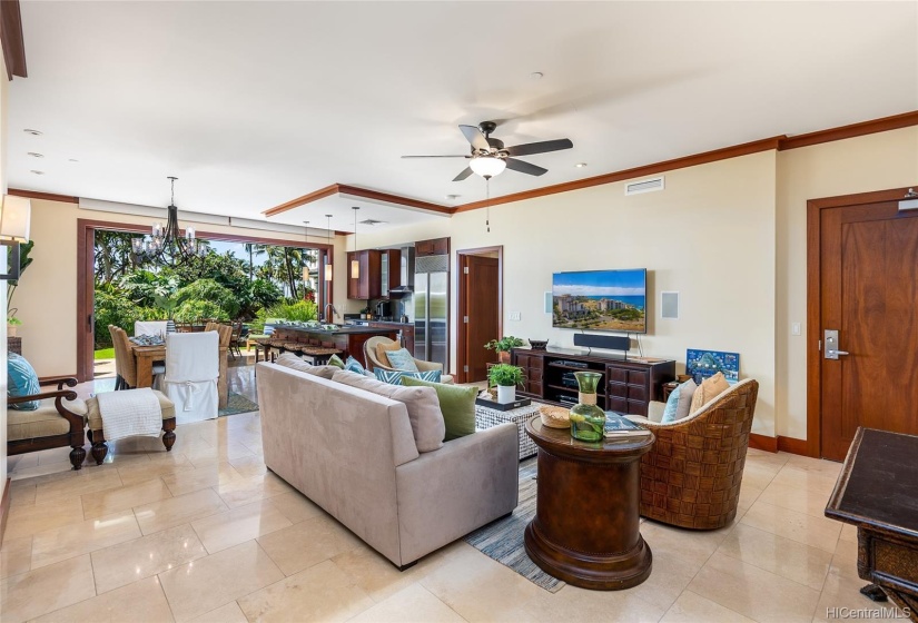 Travertine stone tile flooring throughout the living areas, bathrooms, hallways and covered lanai.