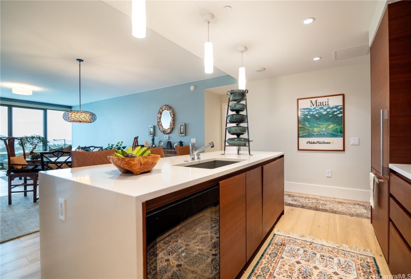 Island with Stainless Sink, Integrated Dishwasher and Wine Cooler.