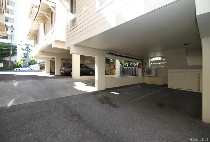 Two Side by Side Covered Parking With Storage Unit