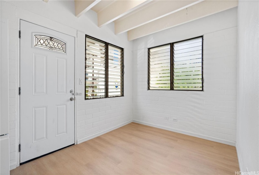 Unit 20 living room with corner windows.