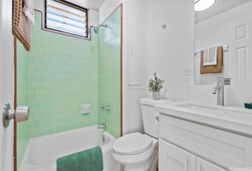 Unit 20 cute tiled bath and new vanity.