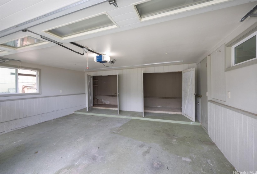 Garage w/ large closets for ample storage. Side door leading to stairs ensure homeowners stay dry when going from their car into the home.