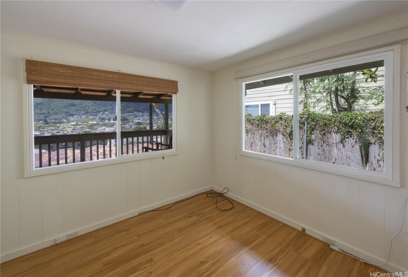 Main bedroom with mountain and city views