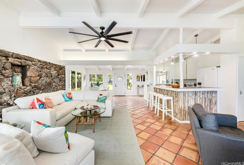 Alternate view of open great room with vaulted ceilings, living area, kitchen, dining area, and comfortable sitting area / den on the right.