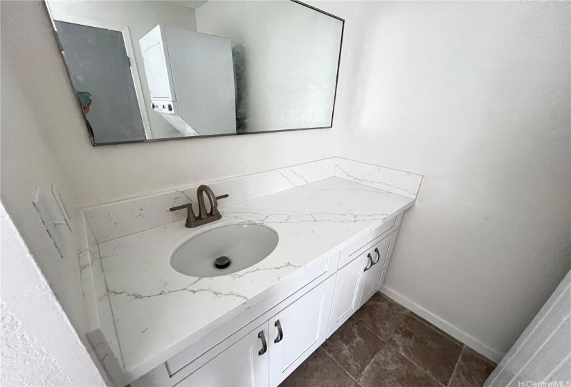 Full size bathroom with new Quarts Counter and Cabinet. LED lighting.