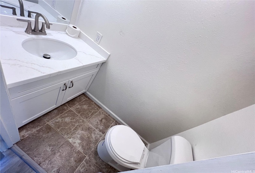 Newly painted 3/4 Bathroom with new fixtures and exhaust fan.