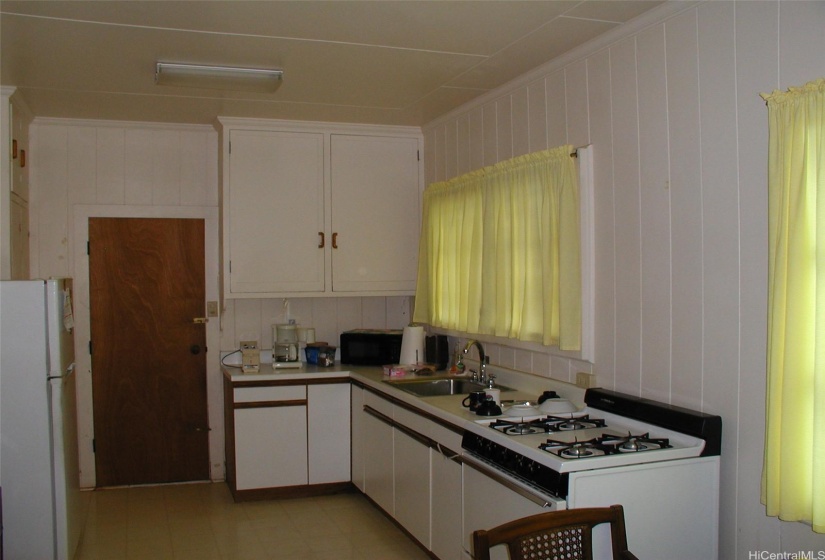 Kitchen with gas stove.