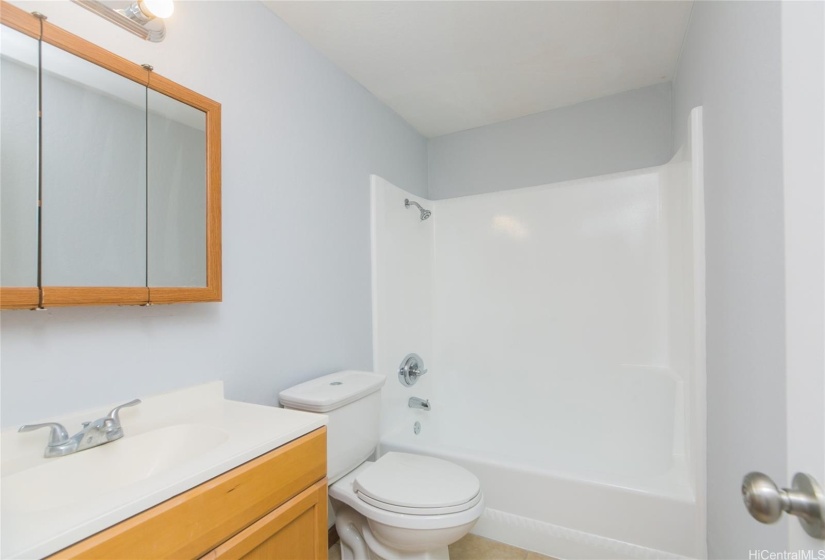 Clean and pretty bath with refinished shower and tub; new fixtures