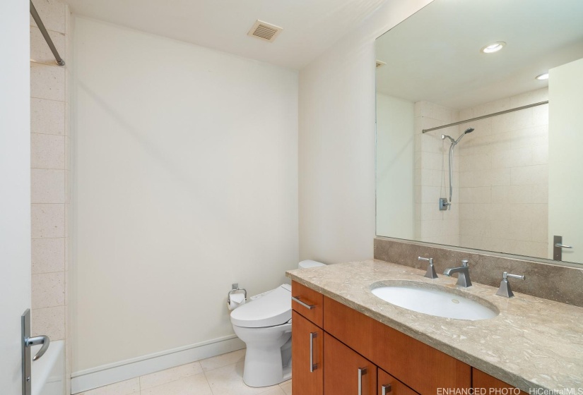 Second bathroom with tub (now shown) Enhanced photo