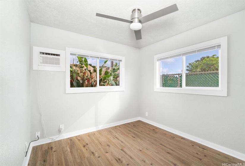 Rear of house bedroom with wall AC.