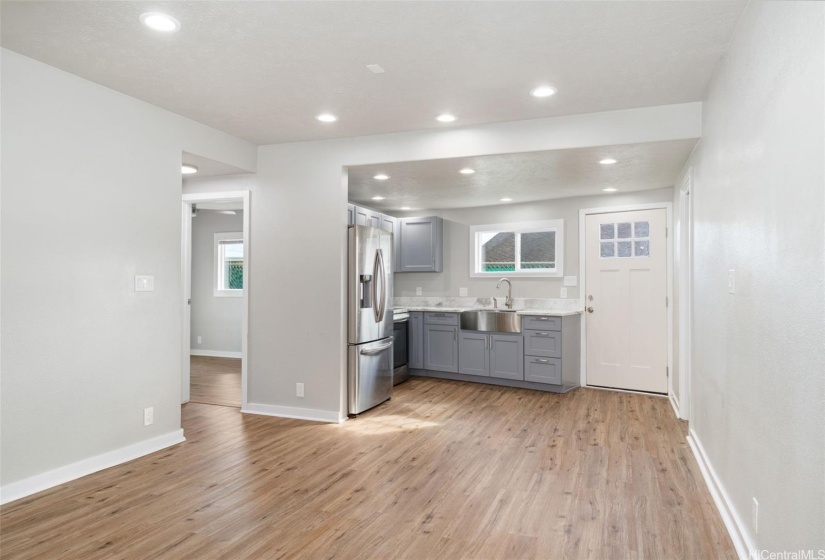 Rear living area with open concept and separate entrance.