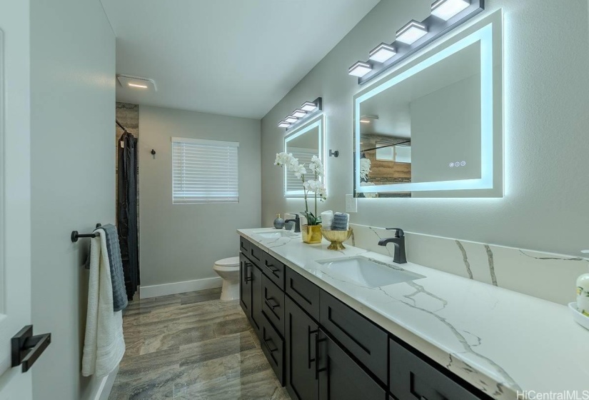 Primary Bathroom, double sink, LED lighted mirrors with defrost..