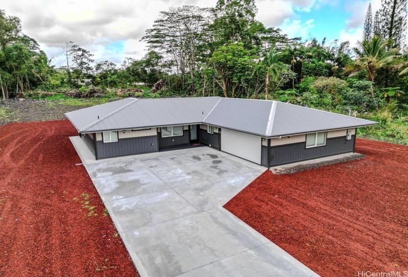 Expansive concrete driveway on 1 acre.