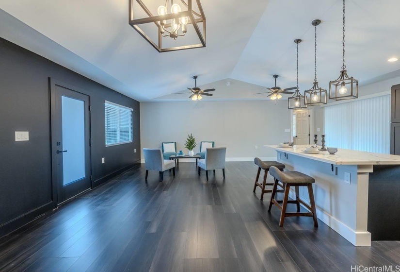 Custom Black accent wall and entry door that blends with the Vinyl life proof flooring throughout the home.