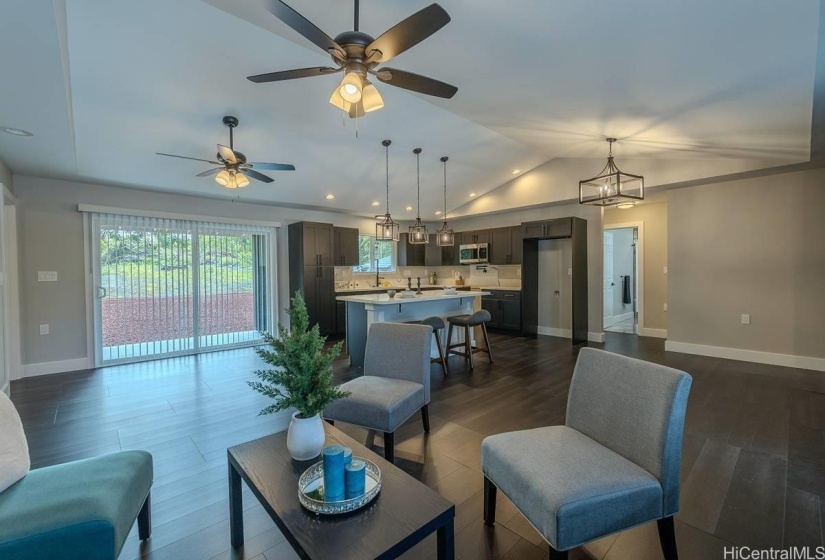 Home offers an open layout, can lighting and ceiling fans in the living and dining area.