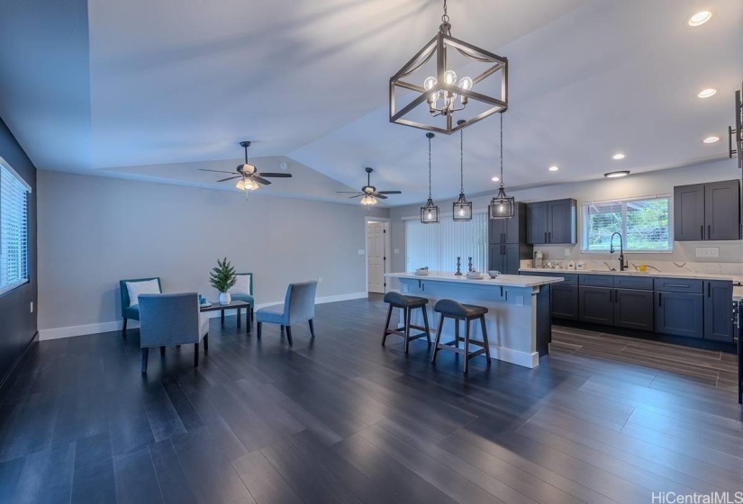 Can lighting in the kitchen, pendent lights over the island, and 2 ceiling fans, with sliders to lanai.