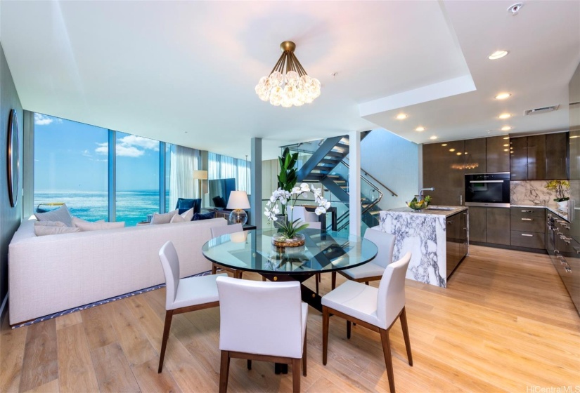 Second level dining area connects to an open-concept living space.