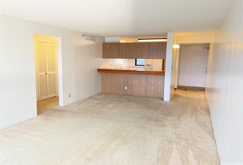 From open lanai (balcony) looking into to spacious living room and kitchen in background