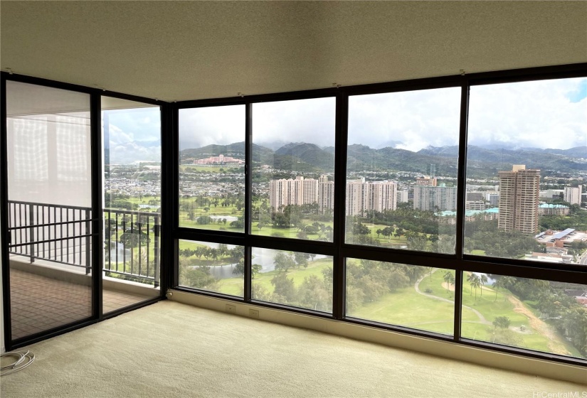 Another view of primary bedroom looking out towards open lanai (balcony).