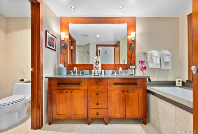 Master bathroom features dual sinks, deep soaking tub and separate shower.