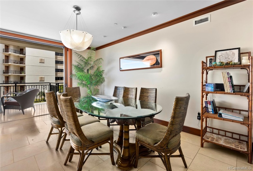 Large dining table with seating for 8, which is more than most Beach Villas offer. Plenty of space due to the large layout and upgraded lighting and wall art.