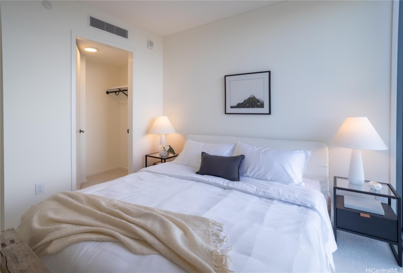 Bedroom with a walk in closet.