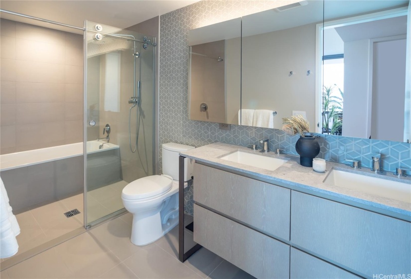 Bathroom with tub conveniently located in the shower stall.