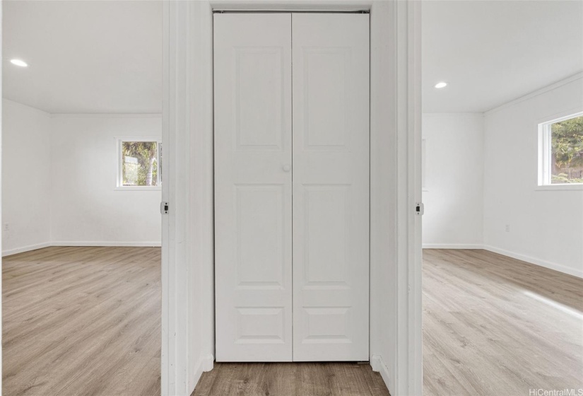 Between the second & third bedroom has the linen closet.