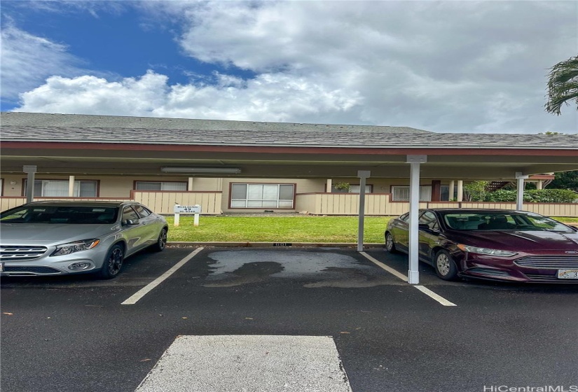 Covered parking space located across from unit (#601).