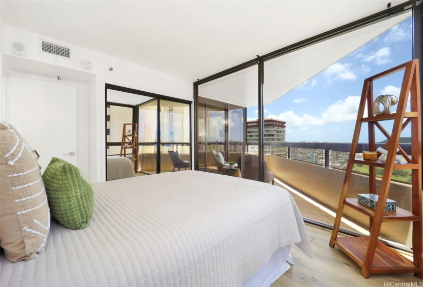 Bedroom with large windows and Diamond Head-facing