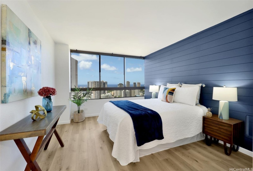 Primary bedroom with view of ocean, sunset views, and beautiful sparkly city lights at night.