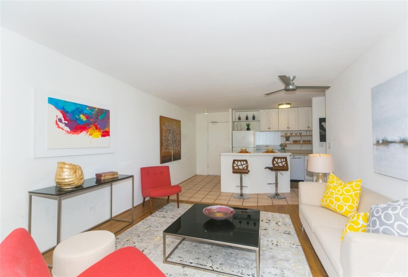 Virtually staged ~ cute living area looking toward front door