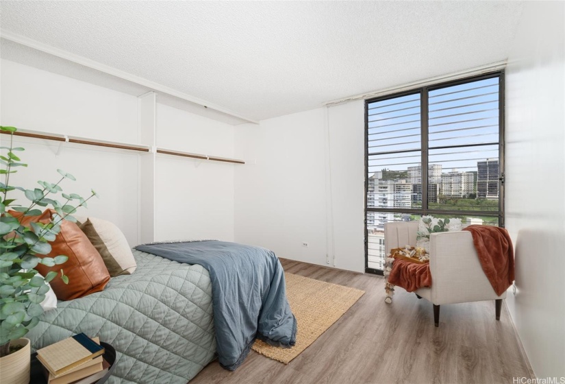 Primary bedroom with a full wall of closet space.