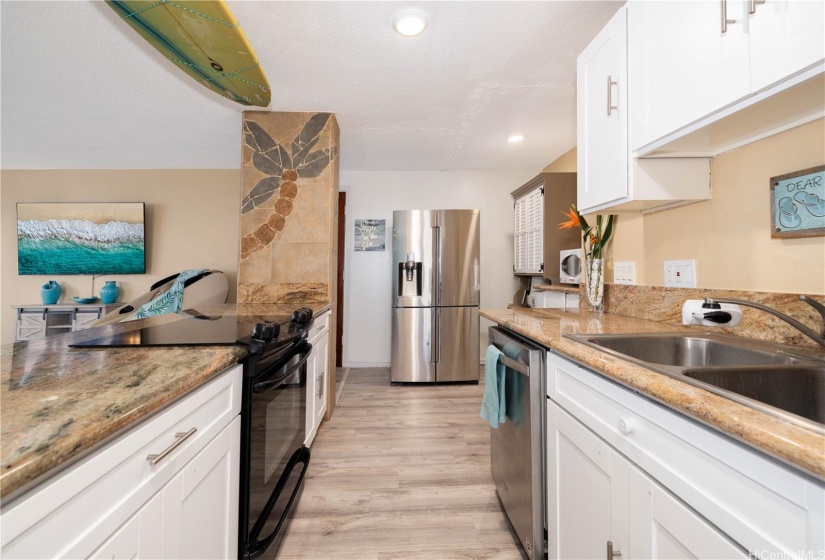 Granite countertops and newly painted cabinets