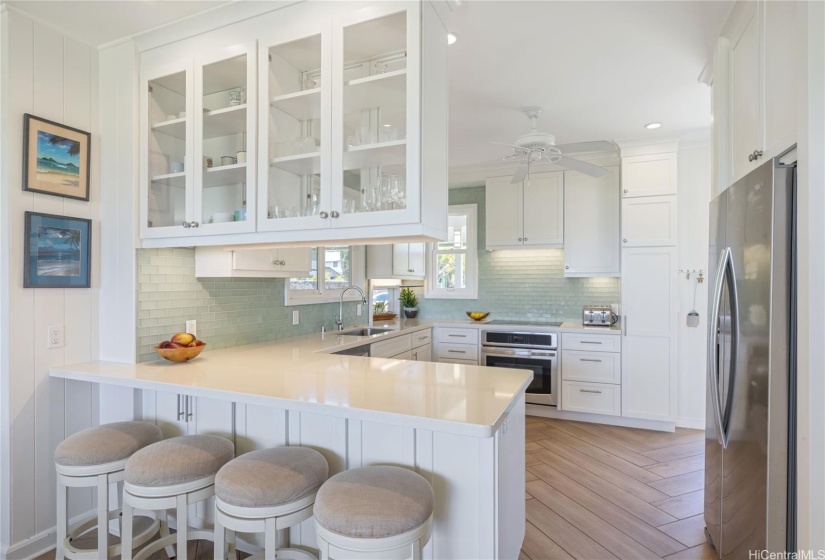 Breakfast bar in bright airy kitchen area.