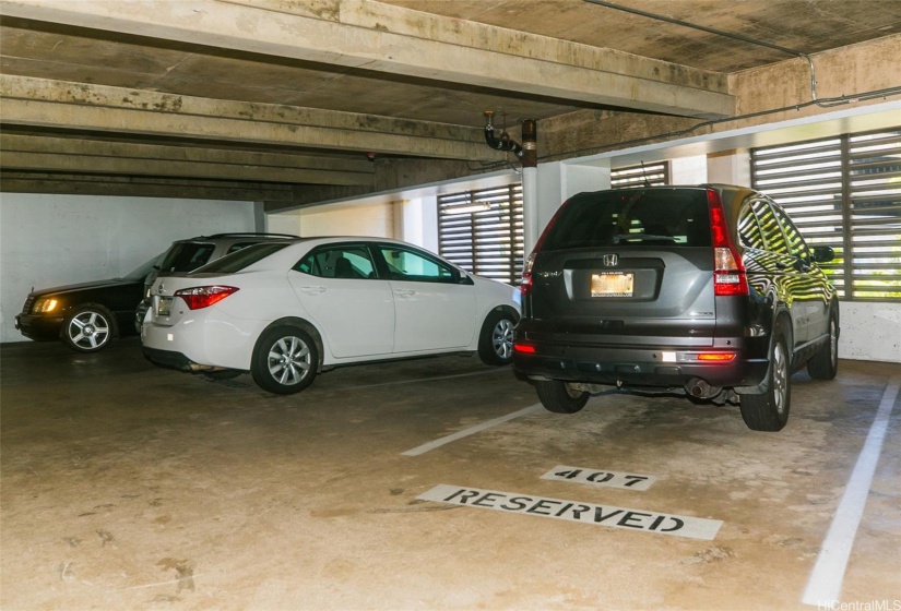 Parking stall located in front of elevator & shopping carts for loading & unloading groceries.