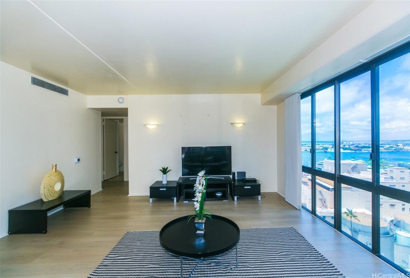 Large living room with view of Honolulu Harbor & Aloha Tower