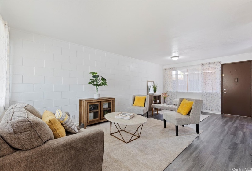 A spacious living and dining room area with updated vinyl sliding windows.