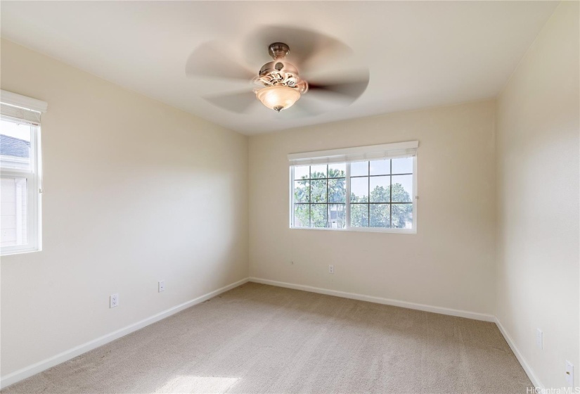 Upstairs bedroom to the right of hallway.