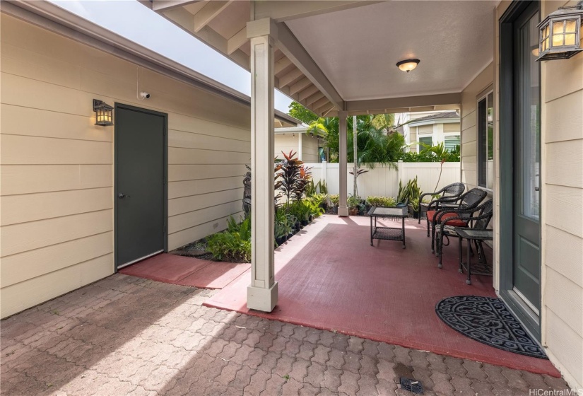 Back area lanai and entrance to 3 car garage.