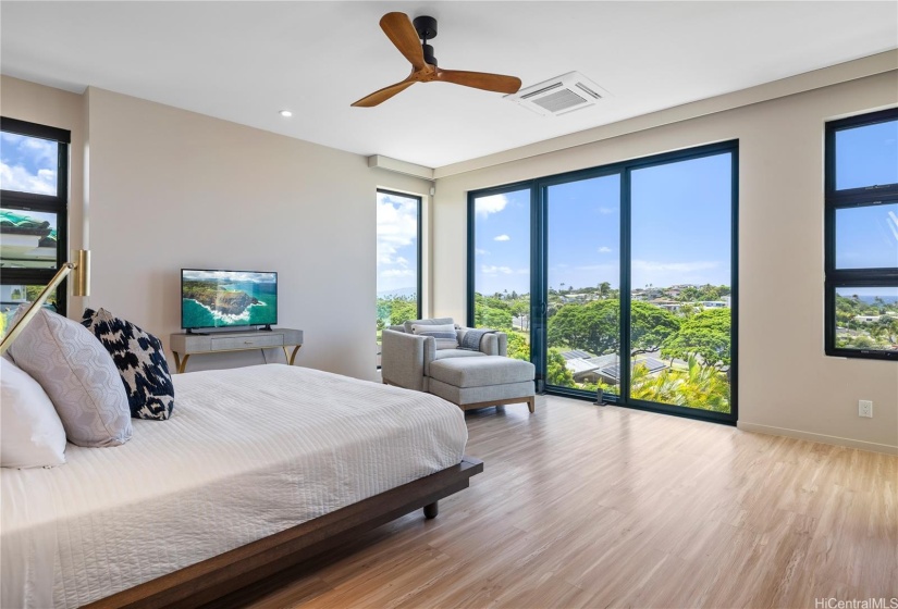 Spacious Primary Bedroom with expansive views of the ocean from Koko Head to Black Point.