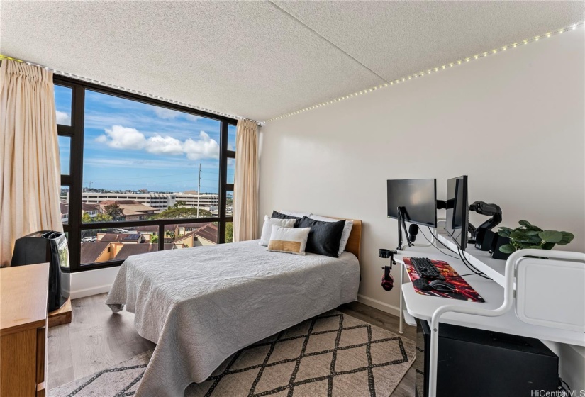 The spacious bedroom can accommodate a large desk too. Ocean views from the bedroom too. The portable A/C unit is included in the sale.