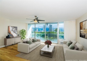 Living Room with floor to ceiling windows and balcony - Enhanced  (virtually staged furniture & accessories)