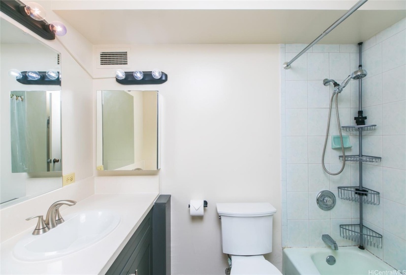 Primary Bedroom's bathroom with tub and shower.