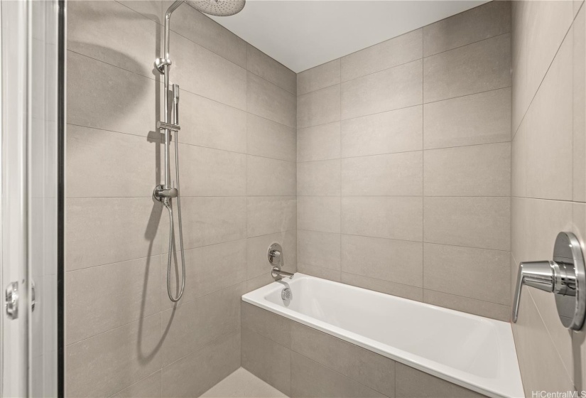 Large bath room with a bath tub and the shower